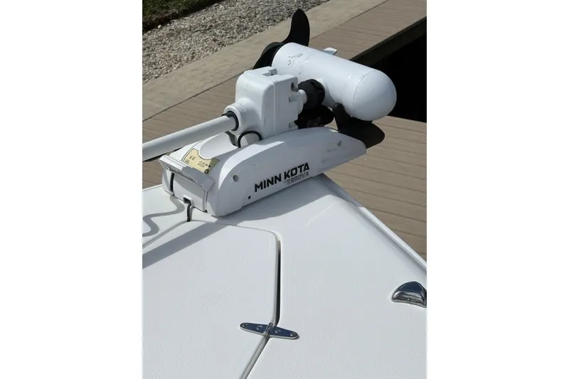 Slide: The Image of 2021 Sea Hunt Gamefish 30 boat on water, featuring forward seating and dual engines. - 28