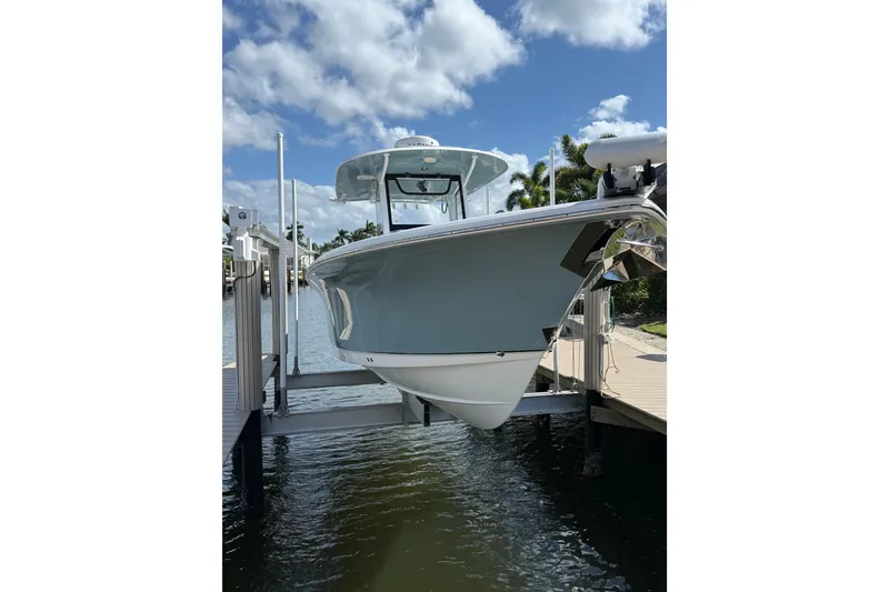 Slide: The Image of 2021 Sea Hunt Gamefish 30 Forward Seating boat on calm water. - 3