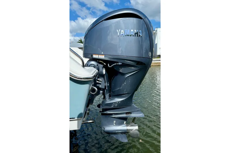Slide: The Image of 2021 Sea Hunt Gamefish 30 boat cruising on calm water under a clear sky. - 7