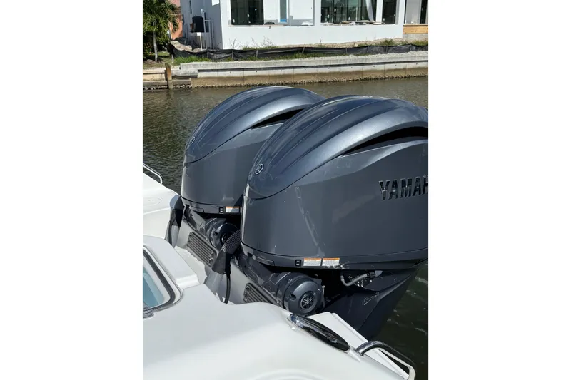 Slide: The Image of 2021 Sea Hunt Gamefish 30 helm with modern navigation displays and steering wheel. - 8