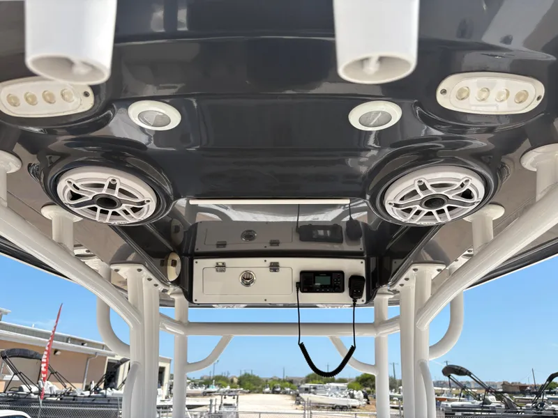 Slide: The Image of 2021 Sportsman Heritage 241 Center Console boat with speakers and electronics on the T-top. - 18
