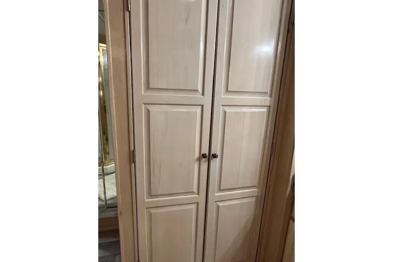 Slide: The Image of Wooden cabinet doors inside a 1995 Sumerset 19.5 x 95 model houseboat. - 14