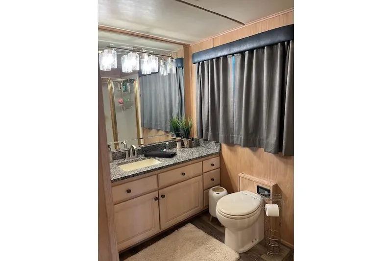 Slide: The Image of Bathroom interior of a 1995 Sumerset 19.5 x 95 houseboat with granite countertop. - 15
