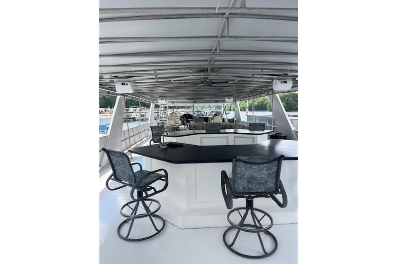 Slide: The Image of Upper deck of 1995 Sumerset 19.5 x 95 houseboat with bar and seating area. - 30