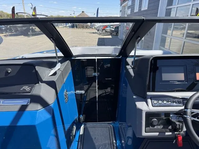 Slide: The Image of Interior view of 2026 Cobalt R6 Surf boat with modern helm console. - 31