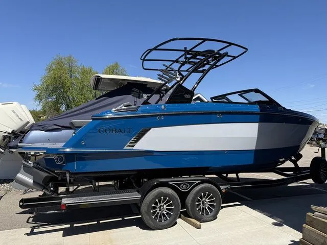 Slide: The Image of 2026 Cobalt R6 Surf boat on trailer, blue sky. - 4
