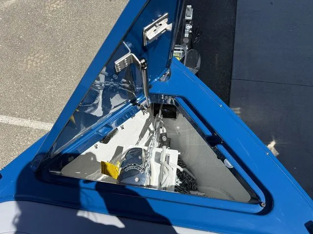 Slide: The Image of 2026 Cobalt R6 Surf boat with open anchor compartment. - 41