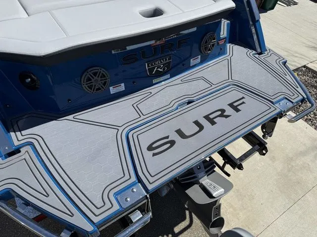 Slide: The Image of Rear view of 2026 Cobalt R6 Surf with surfboard design. - 7