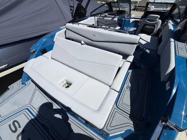 Slide: The Image of Interior of 2026 Cobalt R6 Surf with blue and gray seating. - 9