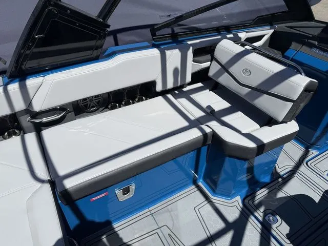 Slide: The Image of Interior of 2026 Cobalt R6 Surf with blue and white seating. - 13