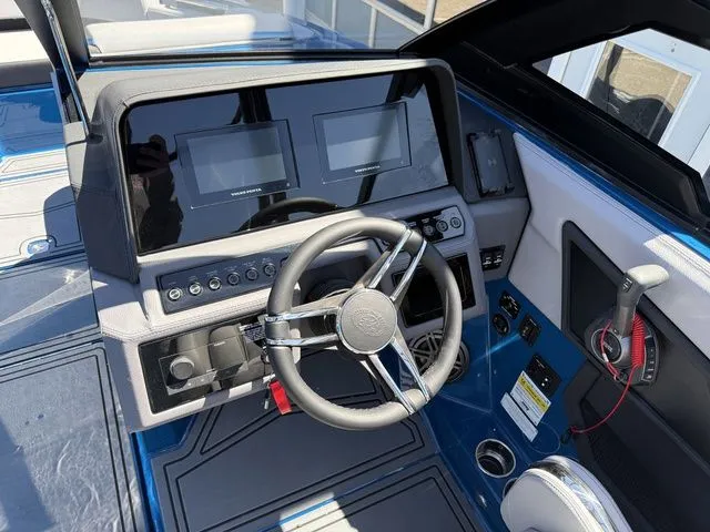 Slide: The Image of Interior view of 2026 Cobalt R6 Surf boat cockpit with modern controls. - 20