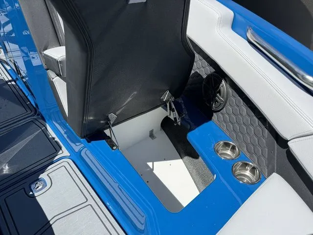 Slide: The Image of Interior of 2026 Cobalt R6 Surf with storage and cup holders. - 35