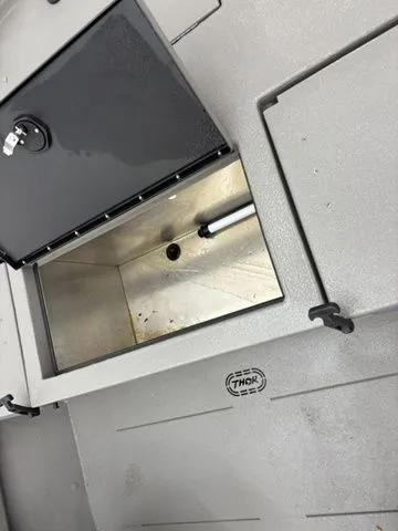 Slide: The Image of Steering wheel and trim switch of a Thor Boats 1900 Lake Hammer. - 26