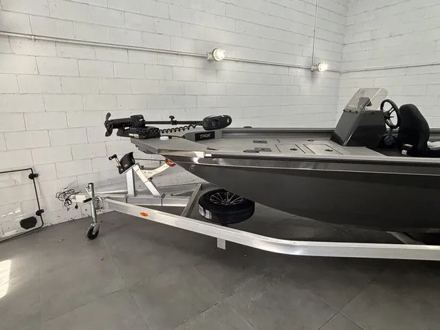 Slide: The Image of Thor Boats 2025 model 1900 Lake Hammer in showroom. - 3
