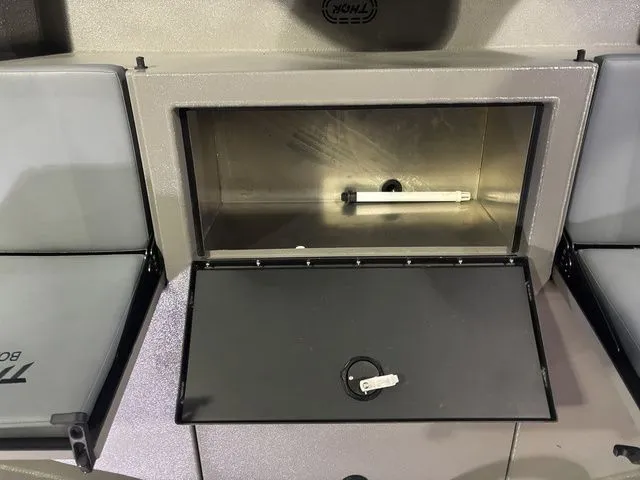 Slide: The Image of Thor Boats 1900 Lake Hammer storage compartment with open lid, 2025 model. - 34