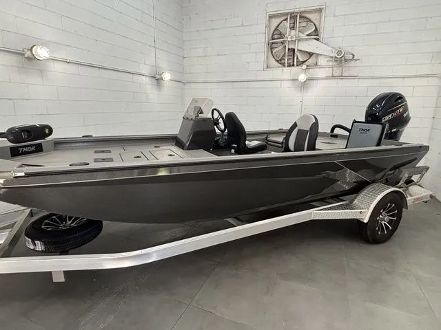 Slide: The Image of 2025 Thor Boats 1900 Lake Hammer Side Console Deluxe on trailer. - 6
