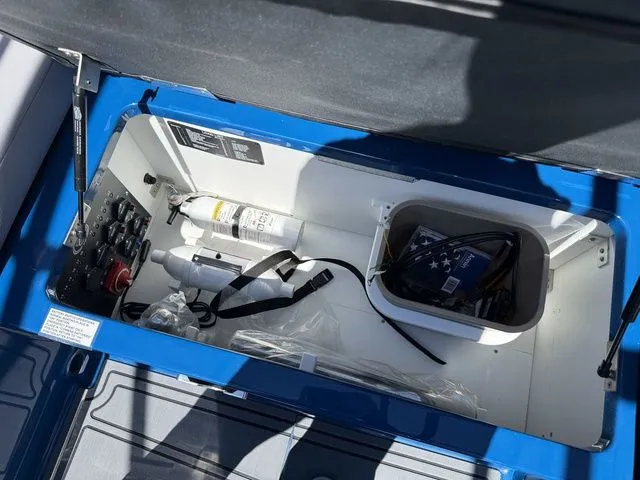Slide: The Image of Storage compartment in 2026 Cobalt R6 Surf boat with accessories. - 14