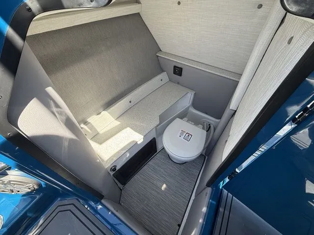 Slide: The Image of Interior of 2026 Cobalt R6 Surf with toilet and seating area. - 29