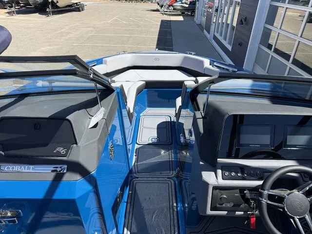 Slide: The Image of Interior view of 2026 Cobalt R6 Surf boat, blue design. - 30