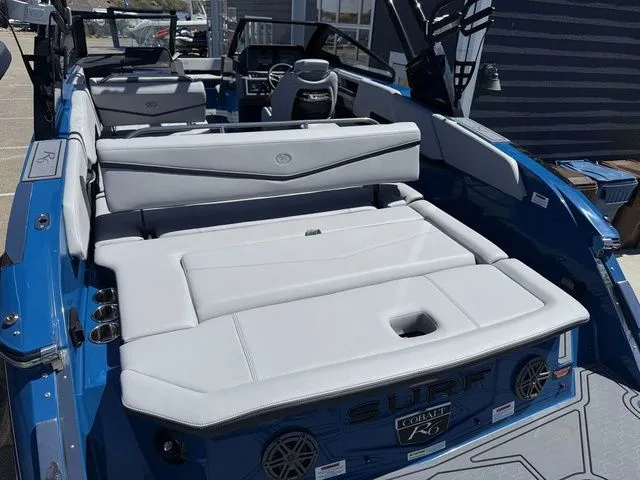 Slide: The Image of 2026 Cobalt R6 Surf boat with luxurious interior and blue accents. - 8