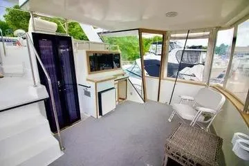 Slide: The Image of Control panel of a 1991 Carver 42 Aft Cabin Motor Yacht with gauges and levers. - 9