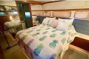Slide: The Image of Bathroom interior of 1991 Carver 42 Aft Cabin Motor Yacht, featuring sink, toilet, and shower. - 15