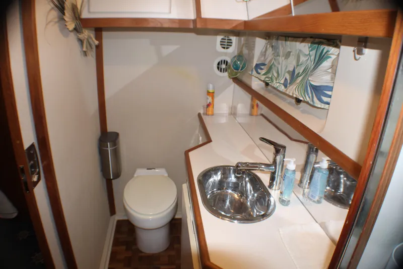 Slide: The Image of Bathroom interior of 1991 Carver 42 Aft Cabin Motor Yacht with sink and toilet. - 36
