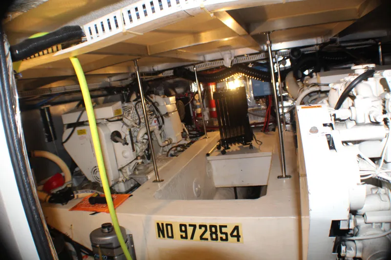 Slide: The Image of Engine room of 1991 Carver 42 Aft Cabin Motor Yacht, showcasing mechanical components. - 38