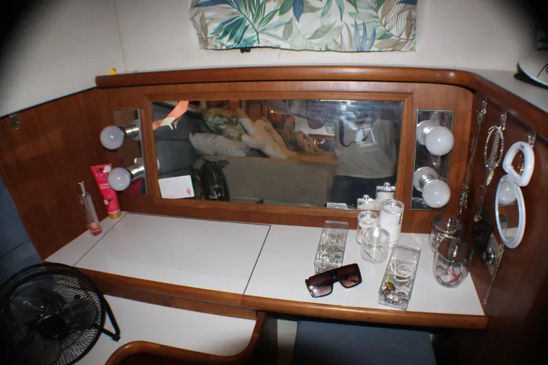 Slide: The Image of Vanity area on 1991 Carver 42 Aft Cabin Motor Yacht with mirror, lights, and accessories. - 43
