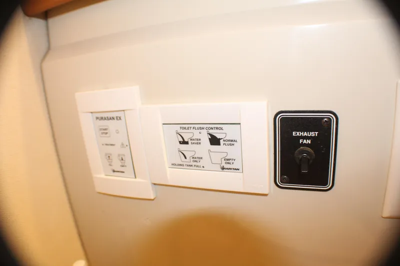 Slide: The Image of Control panel on 1991 Carver 42 Aft Cabin Motor Yacht with toilet and exhaust fan switches. - 47