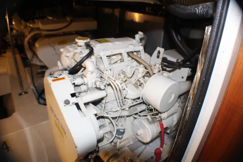 Slide: The Image of Engine room of a 1991 Carver 42 Aft Cabin Motor Yacht, showcasing mechanical components. - 54