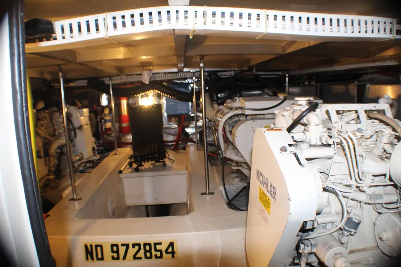 Slide: The Image of Engine room of a 1991 Carver 42 Aft Cabin Motor Yacht, featuring mechanical components. - 56