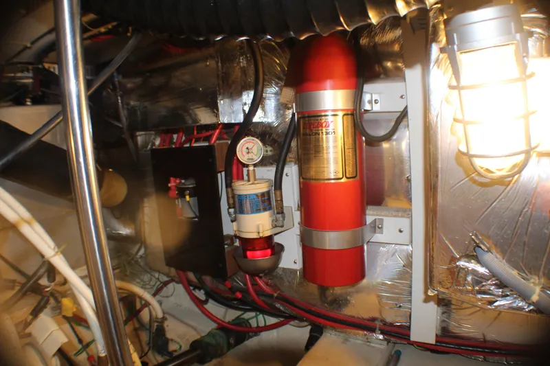 Slide: The Image of Engine room of 1991 Carver 42 Aft Cabin Motor Yacht with fire suppression system. - 57