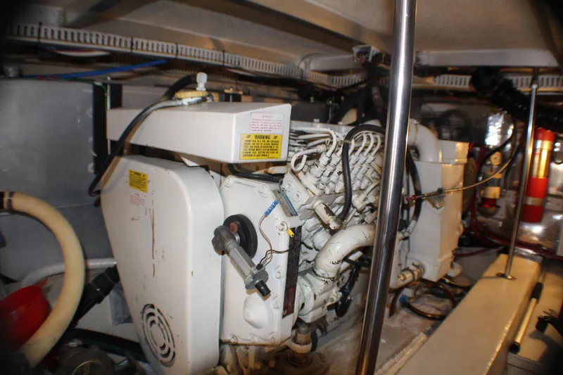 Slide: The Image of Engine room of 1991 Carver 42 Aft Cabin Motor Yacht, showcasing mechanical components. - 58