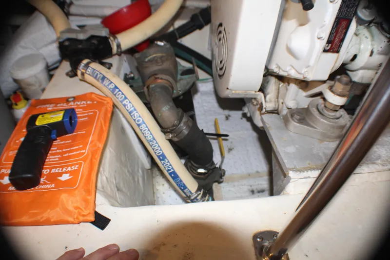 Slide: The Image of Engine room of 1991 Carver 42 Aft Cabin Motor Yacht with tools and equipment. - 59