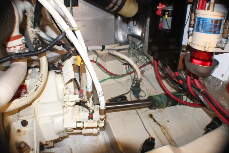 Slide: The Image of Engine room of 1991 Carver 42 Aft Cabin Motor Yacht with visible wiring and components. - 60