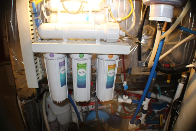Slide: The Image of Water filtration system in a 1991 Carver 42 Aft Cabin Motor Yacht engine room. - 63