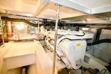Slide: The Image of Engine room of 1991 Carver 42 Aft Cabin Motor Yacht, showcasing mechanical components. - 64