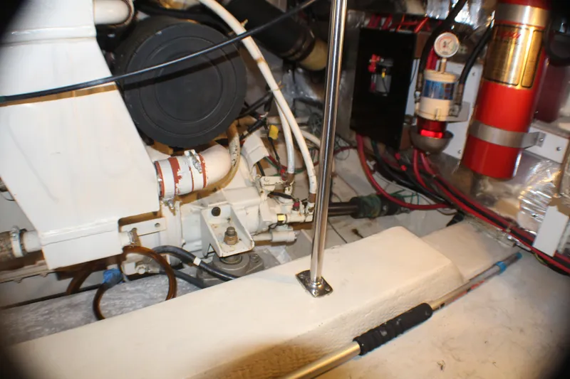 Slide: The Image of Engine room of 1991 Carver 42 Aft Cabin Motor Yacht, showing mechanical components and wiring. - 65