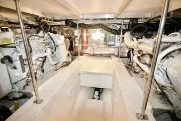 Slide: The Image of Engine room of 1991 Carver 42 Aft Cabin Motor Yacht, showcasing mechanical components. - 69