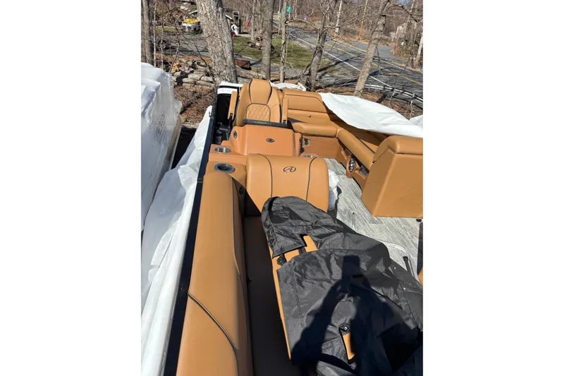 Slide: The Image of 2026 Avalon Venture Cruise Rear Bench with tan leather seats and cup holders. - 14