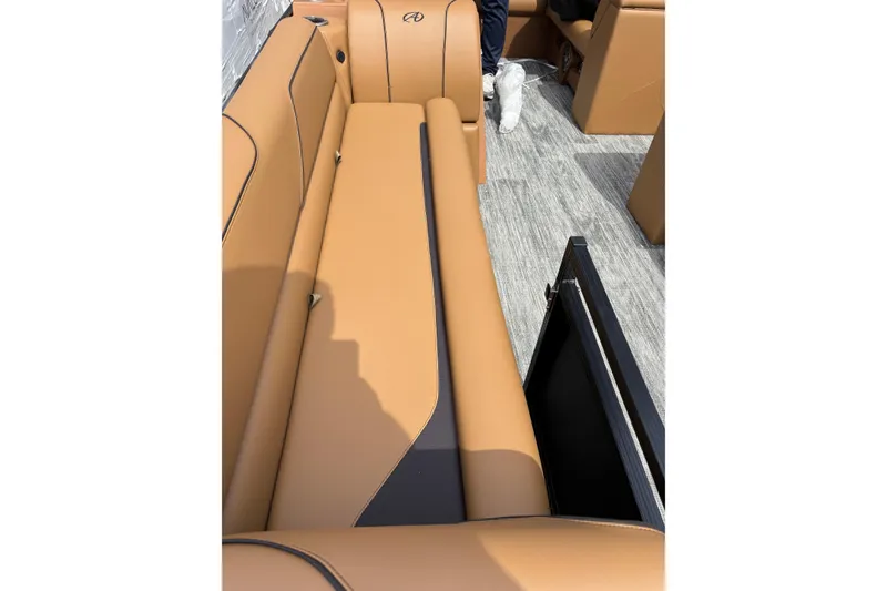 Slide: The Image of 2026 Avalon Venture Cruise Rear Bench with tan upholstery and sleek design. - 16