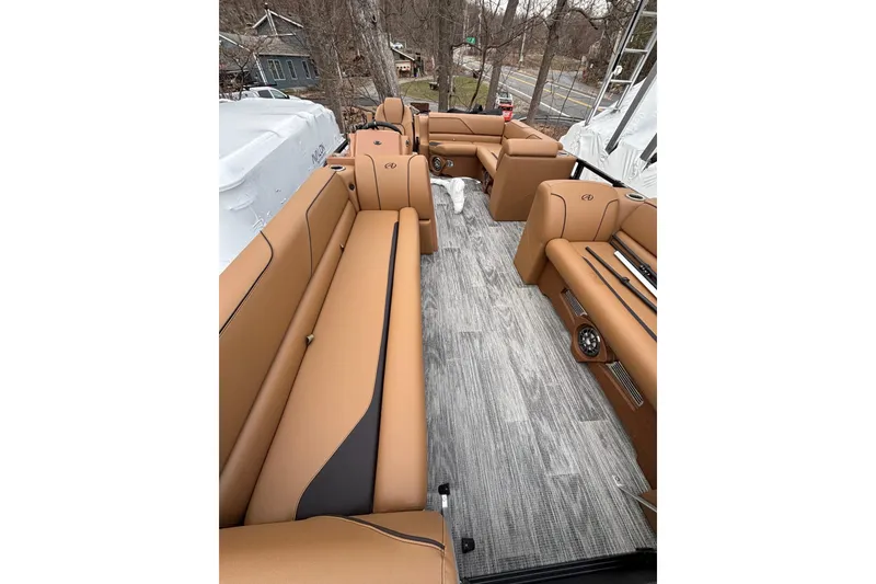 Slide: The Image of Luxurious 2026 Avalon Venture Cruise Rear Bench with tan seating and wood-style flooring. - 17