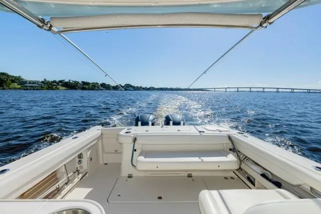 Slide: The Image of 2017 Grady-White Freedom 307 boat cruising on a sunny day, view from the deck. - 12