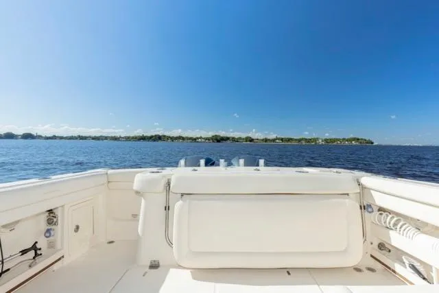 Slide: The Image of 2017 Grady-White Freedom 307 boat on open water under clear blue sky. - 15