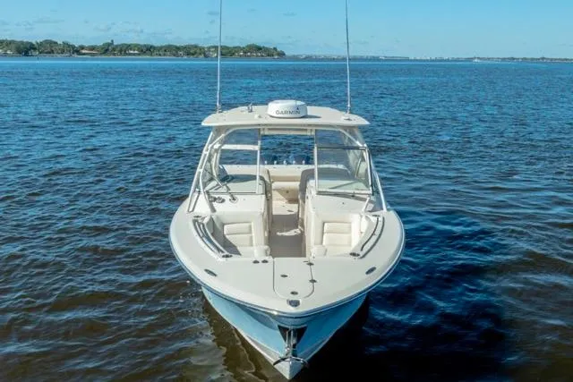 Slide: The Image of 2017 Grady-White Freedom 307 boat on open water, clear sky background. - 28