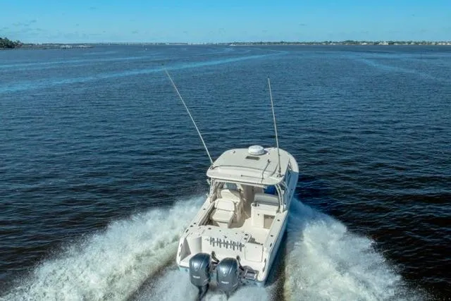 Slide: The Image of 2017 Grady-White Freedom 307 boat cruising on open water. - 43