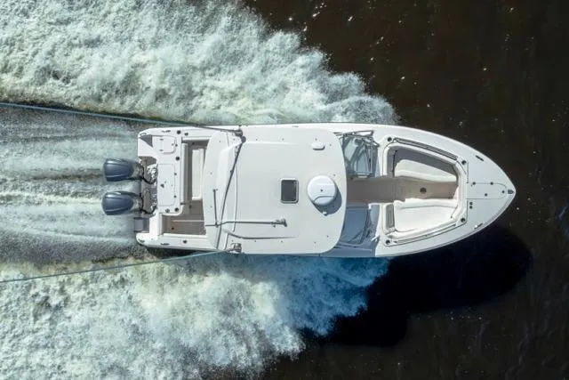 Slide: The Image of Overhead view of 2017 Grady-White Freedom 307 boat cruising on water. - 52