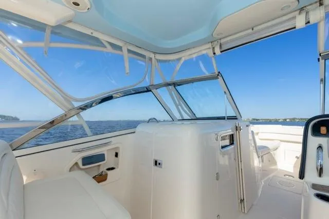 Slide: The Image of 2017 Grady-White Freedom 307 boat interior with ocean view and clear blue sky. - 9