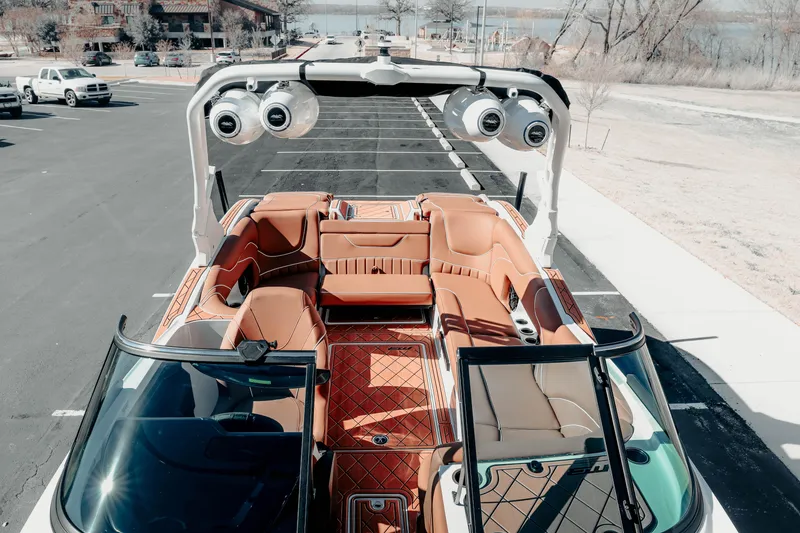 Slide: The Image of 2026 MB B52 23 Alpha boat with luxurious interior and advanced sound system in a parking lot. - 6